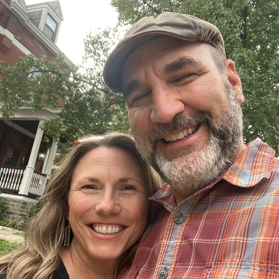 Brian and Trish on a tree-lined street of brick houses